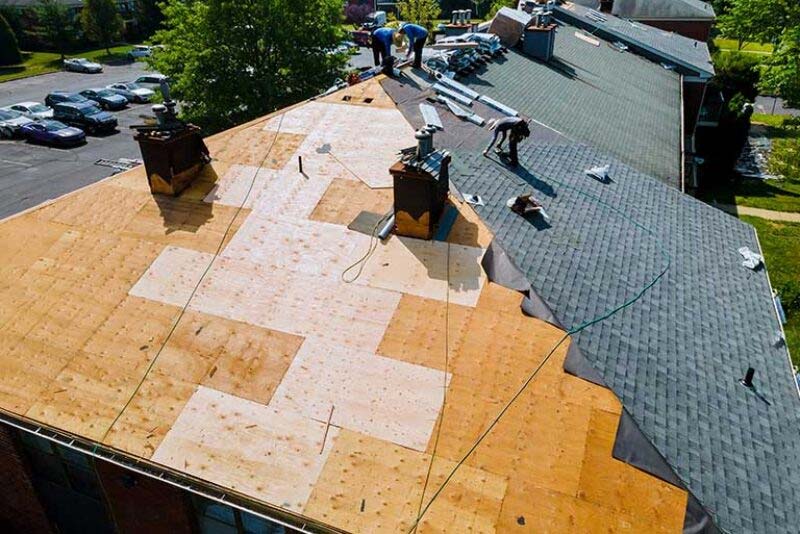 A roof being replaced on an apartment building