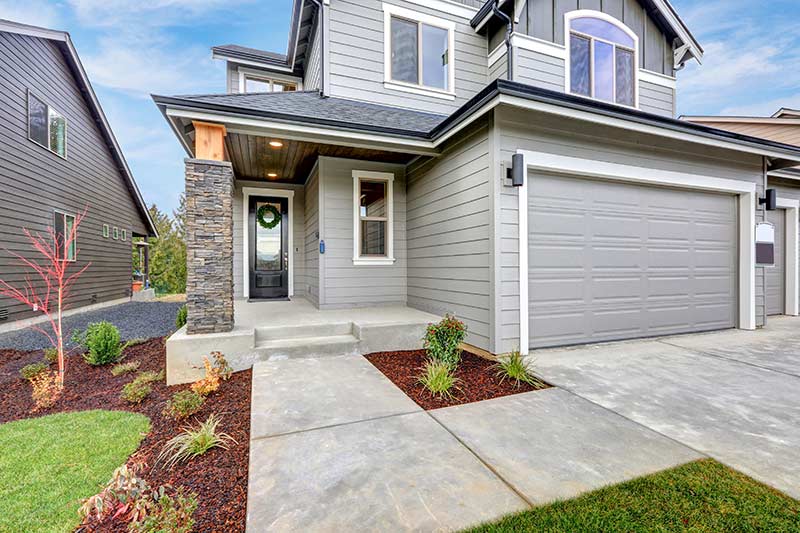 Gray home with wooden siding.