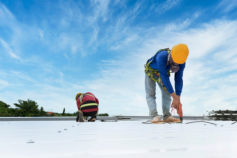 Workers installing a new roof